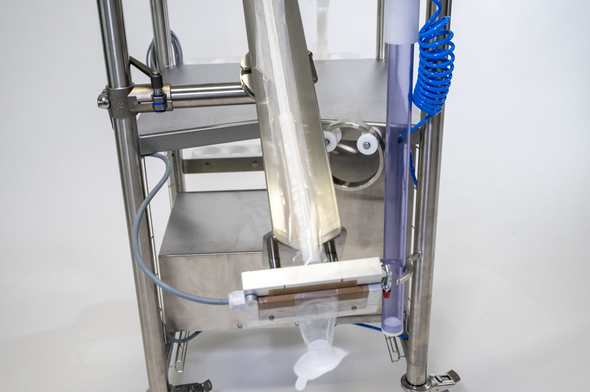 Detailed view of a HECHT Containment Sampling Stick CPS with the thermal welding option, depicting the device's complex assembly with a transparent sampling bag attached, highlighting the technology's capability for secure and sterile sampling in pharmaceutical or chemical industries.